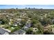 Aerial view of a residential neighborhood with lush trees and a home with a screened-in pool at 1701 Clouser Ave, Orlando, FL 32804