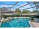 Screened-in pool area with outdoor seating and lush landscaping at 1701 Clouser Ave, Orlando, FL 32804