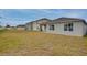Expansive backyard view showcasing the property's large lawn and neighbor homes at 1750 Eagle Hammock Blvd, Eagle Lake, FL 33839