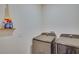 Laundry room with modern washer and dryer units, plus a shelf with stain remover at 1750 Eagle Hammock Blvd, Eagle Lake, FL 33839