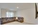 Spacious living room featuring a sectional sofa, a decorative rug, and a wall mounted television at 1750 Eagle Hammock Blvd, Eagle Lake, FL 33839