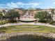 Community with central park featuring a decorative fountain, grassy amphitheater surrounded by walking trails and benches at 1859 Britlyn Aly, Orlando, FL 32814