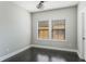 An bedroom featuring hardwood floors and natural light from two windows at 1859 Britlyn Aly, Orlando, FL 32814