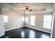 Bedroom with decorative wall design, dark wood floors, and ceiling fan at 1859 Britlyn Aly, Orlando, FL 32814