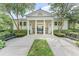 Community clubhouse featuring classic architectural design with stately columns and well-manicured landscaping at 1859 Britlyn Aly, Orlando, FL 32814