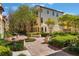 Landscaped community view with manicured lawns, trees, and well-maintained buildings at 1859 Britlyn Aly, Orlando, FL 32814