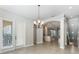Bright dining area with tiled floors, a chandelier, and direct access to an outdoor balcony at 1859 Britlyn Aly, Orlando, FL 32814
