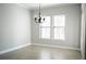 Dining room featuring a chandelier and a view to the exterior at 1859 Britlyn Aly, Orlando, FL 32814