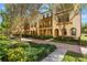 Charming townhouses with lush landscaping, brick pathways, and inviting curb appeal at 1859 Britlyn Aly, Orlando, FL 32814