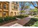Attractive townhome exterior complemented by lush landscaping and inviting walkways, enhancing curb appeal at 1859 Britlyn Aly, Orlando, FL 32814