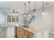 Stylish kitchen island with granite countertops, stainless steel appliances, and pendant lighting at 1859 Britlyn Aly, Orlando, FL 32814