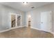 The living area offers tile floors, doors to the stairway and a bathroom for convenience at 1859 Britlyn Aly, Orlando, FL 32814
