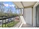 Outdoor balcony area with railing and view of the parking area at 1948 Lake Atriums Cir # 129, Orlando, FL 32839