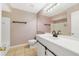 Updated bathroom features a white vanity with a sliding barn door at 1948 Lake Atriums Cir # 129, Orlando, FL 32839