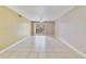 Open living room with tile floors, ceiling fan, and sliding doors leading to a balcony at 1948 Lake Atriums Cir # 129, Orlando, FL 32839