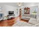 Spacious living room with hardwood floors and large windows at 2413 Tack Room Ln # 2, Orlando, FL 32812