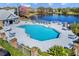 Community pool and sundeck overlooking a picturesque lake at 2413 Tack Room Ln # 2, Orlando, FL 32812