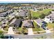 Aerial view of a neighborhood featuring well-maintained homes and manicured lawns at 2491 Bracknell Forest Trl, Tavares, FL 32778