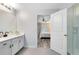 Bathroom features a walk-in shower and a view into the bedroom at 2491 Bracknell Forest Trl, Tavares, FL 32778