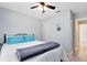 Bedroom featuring wood-look floors, a ceiling fan and doorway at 2491 Bracknell Forest Trl, Tavares, FL 32778