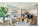 Open-concept living room showcases stylish decor, lots of light, and easy access to dining area at 2568 Kinsale Ln, Ormond Beach, FL 32174