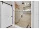 Modern bathroom with a glass enclosed shower, rain shower head, and sleek tile design at 2812 Mulford Ave, Winter Park, FL 32789