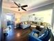 Inviting living room featuring hardwood floors, comfortable seating, and abundant natural light at 2812 Mulford Ave, Winter Park, FL 32789