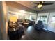 Comfortable living room with a sectional sofa, dark wood floors, and plenty of natural light at 2812 Mulford Ave, Winter Park, FL 32789