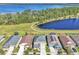 Gorgeous aerial view of homes near a lake and lush green walking trails at 3128 Dark Sky Dr, Harmony, FL 34773