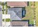 Aerial view of a home with a well-maintained roof and surrounding greenery at 3128 Dark Sky Dr, Harmony, FL 34773