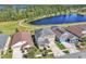 Stunning aerial shot of a residential home with a lake view and lush greenery surrounding the property at 3128 Dark Sky Dr, Harmony, FL 34773