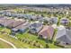 This is an aerial view of a home with a large backyard and surrounding neighborhood at 3128 Dark Sky Dr, Harmony, FL 34773