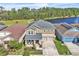 Inviting two-story home with a well-manicured lawn, two-car garage, and a charming front porch at 3128 Dark Sky Dr, Harmony, FL 34773