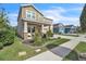Charming two-story home with a well-manicured lawn and mature landscaping at 3128 Dark Sky Dr, Harmony, FL 34773