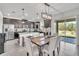 Kitchen with stainless steel appliances, granite countertops, and a view of the backyard at 3128 Dark Sky Dr, Harmony, FL 34773