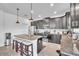 Modern kitchen boasts granite counters, stainless steel appliances, and dark wood cabinets at 3128 Dark Sky Dr, Harmony, FL 34773