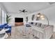 Inviting living room with modern decor, a ceiling fan, and plenty of natural light at 3128 Dark Sky Dr, Harmony, FL 34773