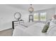 Inviting main bedroom with plenty of natural light, a cozy bed, and stylish decor at 3128 Dark Sky Dr, Harmony, FL 34773