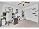 Functional home office featuring a ceiling fan, carpet, and ample storage space at 3128 Dark Sky Dr, Harmony, FL 34773