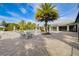 Spacious pool deck with lounge chairs and tables under sunny skies at 3128 Dark Sky Dr, Harmony, FL 34773