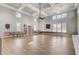 Large recreation room featuring beautiful floors, large windows and a variety of seating options at 3128 Dark Sky Dr, Harmony, FL 34773