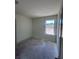 Bright, neutral bedroom with a window offering a pleasant outdoor view at 3219 Cup Dr, Lakeland, FL 33803
