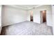Bedroom with neutral carpet and en suite bathroom at 3219 Cup Dr, Lakeland, FL 33803