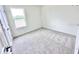 Bedroom with carpeted floor and a window with a view of the outside at 3219 Cup Dr, Lakeland, FL 33803