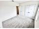 Bedroom with carpeted floor and a closet with double doors at 3219 Cup Dr, Lakeland, FL 33803