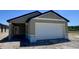 Charming single-story home featuring a two-car garage and neutral color palette at 3219 Cup Dr, Lakeland, FL 33803