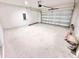 Empty garage with an automatic door and concrete floor at 3219 Cup Dr, Lakeland, FL 33803