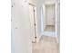 Hallway with doors and tile floors at 3219 Cup Dr, Lakeland, FL 33803