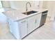 Kitchen island with stainless steel sink, faucet, and dishwasher at 3219 Cup Dr, Lakeland, FL 33803