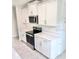Close up of kitchen with white cabinets and stainless steel appliances at 3219 Cup Dr, Lakeland, FL 33803